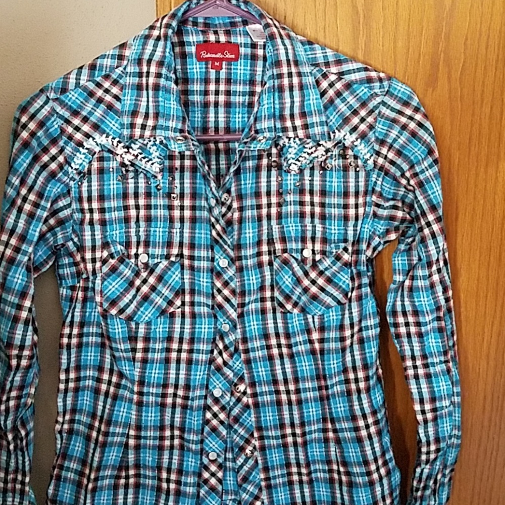 Western shirt has pearl snaps